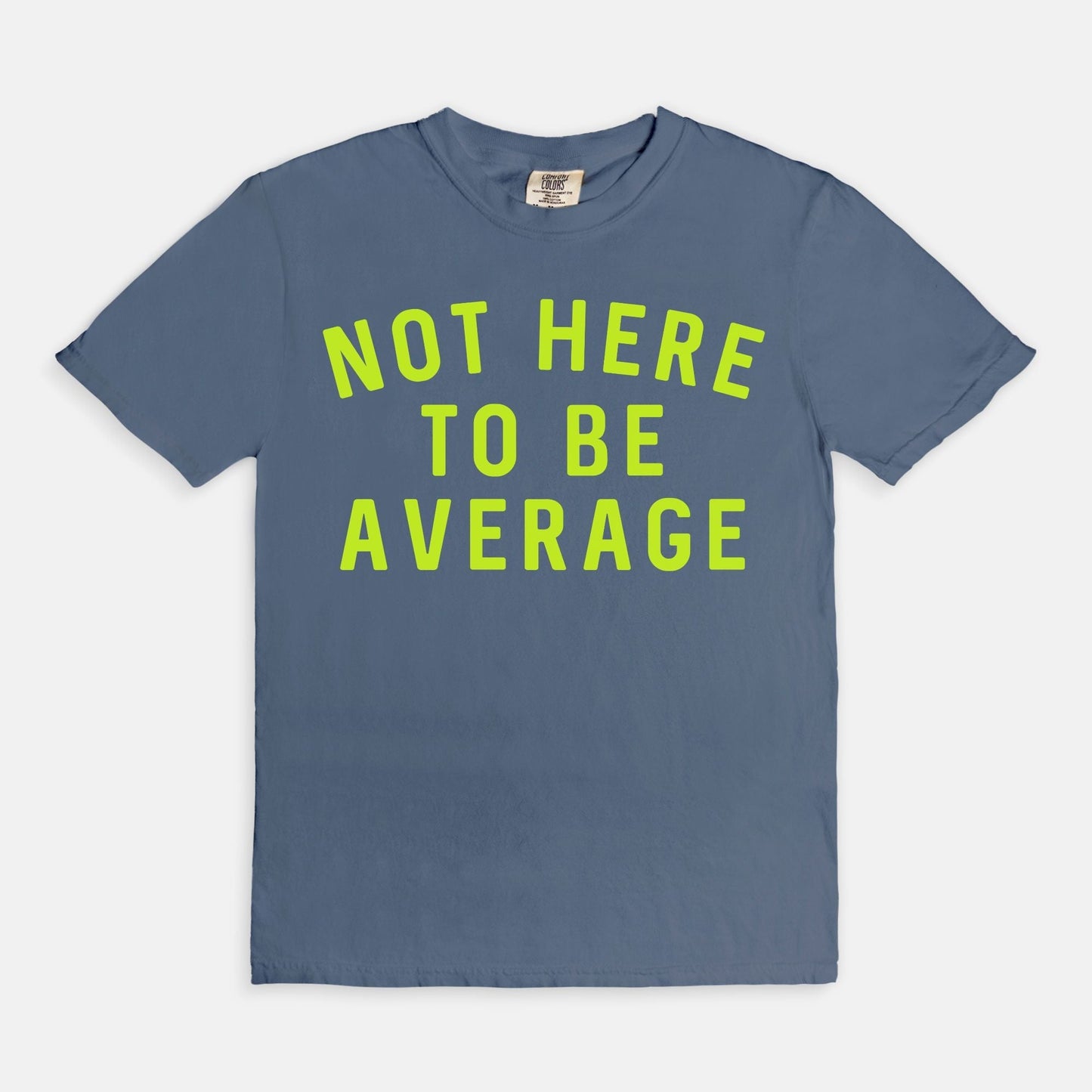 Shop the Not Here To Be Average T-Shirt in Blue Jean. Free shipping. Buy today at Up & Comer!