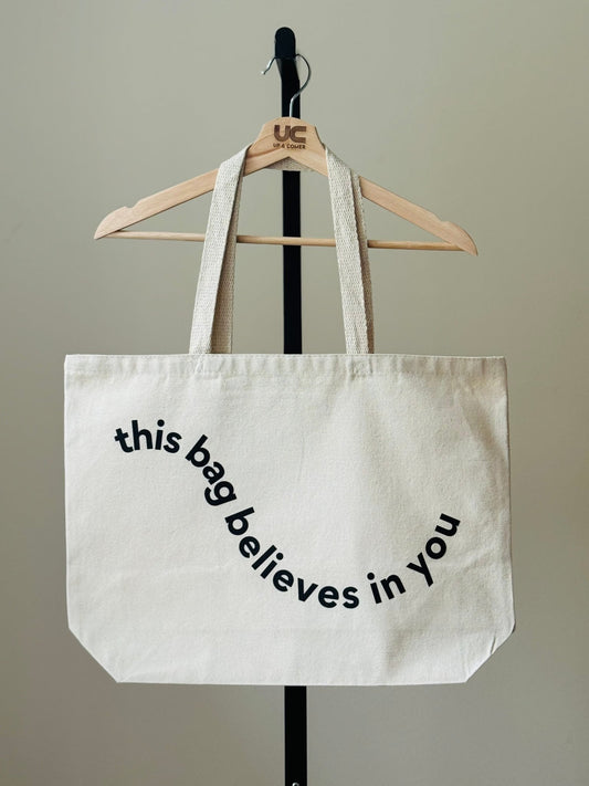Shop the This Bag Believes In You Tote Bags at Up & Comer. Free shipping!